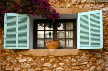 window with blue shutters