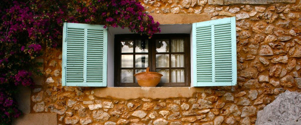 Brick building with green slit window doors