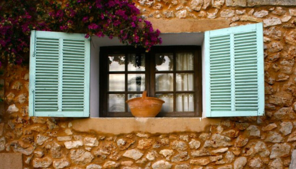 Brick building with green slit window doors
