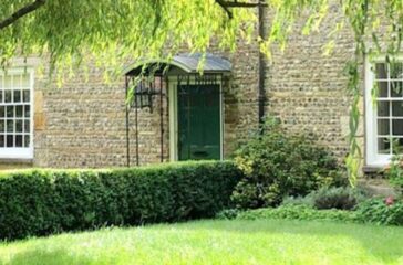 Property with Willow Tree in garden